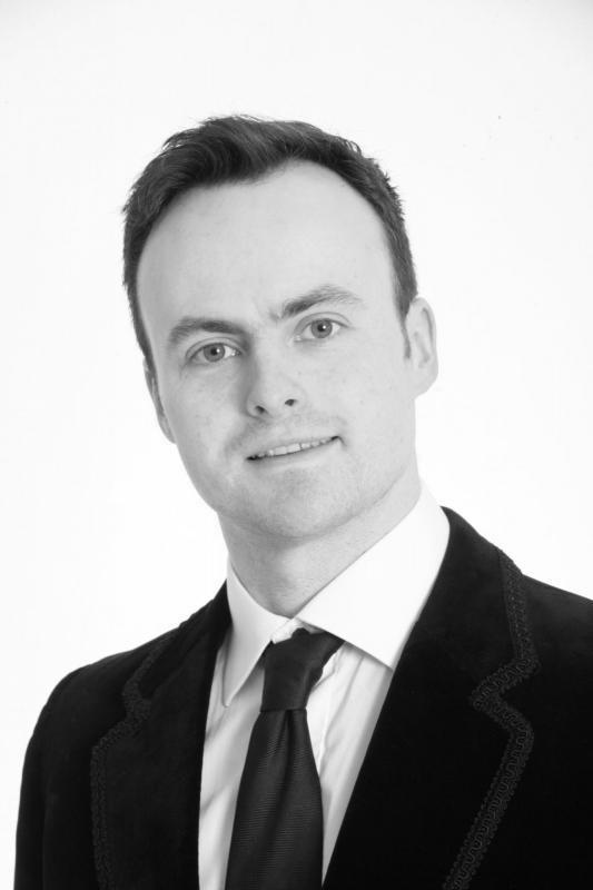 Alex Cooper B&W headshot